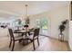 Elegant dining area with a modern chandelier and access to the outdoor space at 2101 Champlain Dr, Boulder, CO 80301