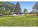 Charming home with a well-manicured lawn and mature trees at 2101 Champlain Dr, Boulder, CO 80301