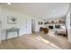 Comfortable living area with a brick fireplace, hardwood floors and bright natural light at 2101 Champlain Dr, Boulder, CO 80301