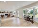 Cozy living room with a decorative fireplace, hardwood floors and natural light at 2101 Champlain Dr, Boulder, CO 80301
