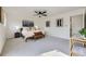 A spacious main bedroom with a ceiling fan and a seating bench at 2101 Champlain Dr, Boulder, CO 80301