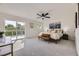 Spacious bedroom with a ceiling fan and balcony access at 2101 Champlain Dr, Boulder, CO 80301