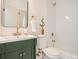 Bathroom featuring a modern vanity, classic fixtures, and a tiled shower with tub at 21472 E 46Th Ave, Denver, CO 80249