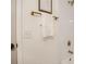 Bathroom features stylish white tiled walls and a golden shower head with sleek fixtures at 21472 E 46Th Ave, Denver, CO 80249
