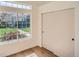 Bedroom features a large window with neighborhood views and a sliding door closet at 21472 E 46Th Ave, Denver, CO 80249