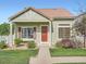 Charming single-story home with a red tiled roof, green siding, and well-maintained landscaping at 21472 E 46Th Ave, Denver, CO 80249