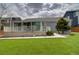 Backyard featuring manicured lawn, patio, and a well-maintained exterior at 10132 Nickolas Ave, Highlands Ranch, CO 80130