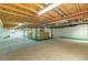 Unfinished basement with exposed ceiling, concrete floor, and a window at 10132 Nickolas Ave, Highlands Ranch, CO 80130