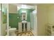 Cozy bathroom with pedestal sink, toilet, shower and storage space at 10132 Nickolas Ave, Highlands Ranch, CO 80130