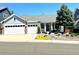 Charming single-story home with a two-car garage and beautifully landscaped front yard, offering great curb appeal at 10132 Nickolas Ave, Highlands Ranch, CO 80130