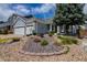 Charming home with a well-manicured front yard and two-car garage at 10132 Nickolas Ave, Highlands Ranch, CO 80130