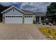 Attractive home with a two-car garage and beautifully landscaped front yard at 10132 Nickolas Ave, Highlands Ranch, CO 80130