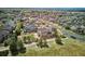 Expansive aerial view of a neighborhood featuring well-maintained homes and landscaping, showcasing community layout at 282 N De Gaulle St, Aurora, CO 80018