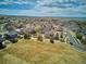 Aerial view of a neighborhood showing the community layout and proximity to open spaces and roads at 282 N De Gaulle St, Aurora, CO 80018