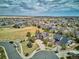 Expansive aerial view of a residential community, showcasing well-maintained homes, green spaces, and neighborhood charm at 282 N De Gaulle St, Aurora, CO 80018