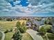 Stunning aerial view of a spacious home with solar panels, a large yard, and a beautifully landscaped neighborhood at 282 N De Gaulle St, Aurora, CO 80018