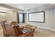 Home theater setup in basement with comfortable seating and a large screen for entertainment at 282 N De Gaulle St, Aurora, CO 80018