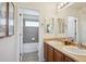 Bright bathroom featuring a double vanity with framed mirrors and a separate shower and tub at 282 N De Gaulle St, Aurora, CO 80018