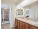 Primary bathroom with double sinks, vanity and separate shower, exuding a spa-like ambiance at 282 N De Gaulle St, Aurora, CO 80018