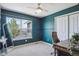 Cozy bedroom with stylish chair, window view, and large closet for ample storage at 282 N De Gaulle St, Aurora, CO 80018