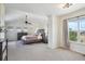 Tranquil main bedroom with vaulted ceiling, large windows, and a calming color palette at 282 N De Gaulle St, Aurora, CO 80018