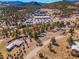 Scenic aerial view of mountain home surrounded by lush trees at 3817 Ponderosa Dr, Evergreen, CO 80439