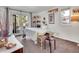 Bright, airy bedroom featuring french doors to the outdoor deck at 3817 Ponderosa Dr, Evergreen, CO 80439