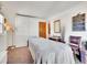 Calm bedroom with natural light, Murphy bed and closet space at 3817 Ponderosa Dr, Evergreen, CO 80439