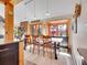 Dining room featuring a view of the outdoor scenery, complemented by a window and wooden table at 3817 Ponderosa Dr, Evergreen, CO 80439