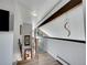 Upstairs hallway featuring unique railing and beam at 3817 Ponderosa Dr, Evergreen, CO 80439