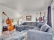 Cozy living room with plush sectional sofa and artistic accents at 3817 Ponderosa Dr, Evergreen, CO 80439