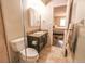 Cozy bathroom featuring a vanity with a granite countertop and convenient access to the bedroom at 3460 S Poplar St # 204, Denver, CO 80224