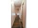 Hallway with wood floors and multiple doors leading to different rooms in the home at 3460 S Poplar St # 204, Denver, CO 80224