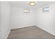 Basement bedroom featuring neutral carpeting and two small, bright windows at 1290 S Honey Way, Denver, CO 80224