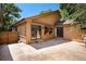 Backyard patio area with sliding glass doors, perfect for outdoor entertaining and relaxation at 136 S Eagle Cir, Aurora, CO 80012