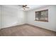 Bedroom with neutral carpet, ceiling fan, and one window, offering natural light at 136 S Eagle Cir, Aurora, CO 80012
