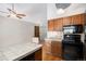 Efficient kitchen with an island and cabinets, with modern appliances and hardwood floors at 136 S Eagle Cir, Aurora, CO 80012