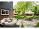 Backyard with a patio, fire pit and dining table for outdoor entertaining at 10000 E Ohio Ave, Denver, CO 80247