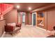 Basement seating area with unique wall decorations and accent lighting at 10000 E Ohio Ave, Denver, CO 80247