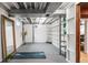 Unfinished basement with exposed beams, storage shelving, and ample open space for customization at 10000 E Ohio Ave, Denver, CO 80247