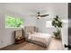 Bright bedroom with hardwood floors, large windows, and a comfortable, modern design at 10000 E Ohio Ave, Denver, CO 80247