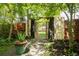 Unique garden gate made of repurposed doors, leading to a tranquil backyard space at 10000 E Ohio Ave, Denver, CO 80247