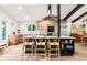 Bright, modern kitchen featuring a sleek island with bar seating, stainless steel appliances, and ample counter space at 10000 E Ohio Ave, Denver, CO 80247