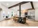 Spacious kitchen featuring a large island with bar seating, stainless steel appliances, and modern finishes at 10000 E Ohio Ave, Denver, CO 80247