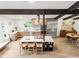 Modern kitchen boasts an island with seating, stainless steel appliances, and stylish light wood cabinetry at 10000 E Ohio Ave, Denver, CO 80247