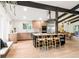 Bright kitchen with wooden cabinets, stainless steel appliances, and a modern island with seating at 10000 E Ohio Ave, Denver, CO 80247