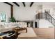 Open living area featuring lots of natural light and steel staircase to the second level at 10000 E Ohio Ave, Denver, CO 80247