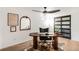 Home office with modern desk, decor and a barn door closet at 10000 E Ohio Ave, Denver, CO 80247