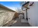 Private backyard patio area with paving stones and covered grill at 3947 Winona Ct, Denver, CO 80212