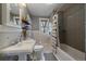 Updated bathroom with subway tile, a new vanity, and decorative shelving at 3947 Winona Ct, Denver, CO 80212